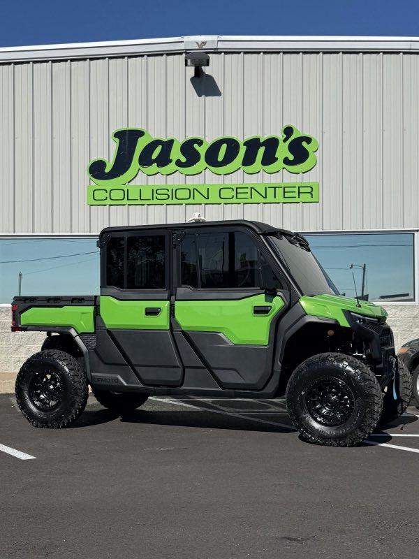 Jason's Collision Center painted sign above the shop with a vehicle parked below
